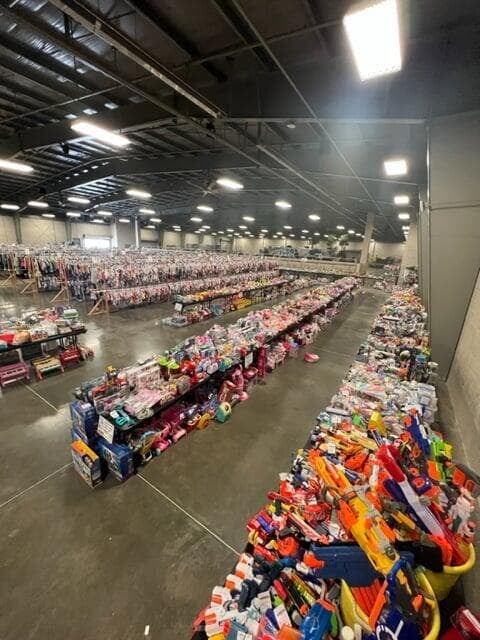 sale floor photo of toys shoes books and clothes