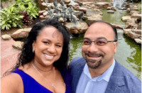 A mom and her three kids stand in front of a rack of girls clothes at their local BF sale.
